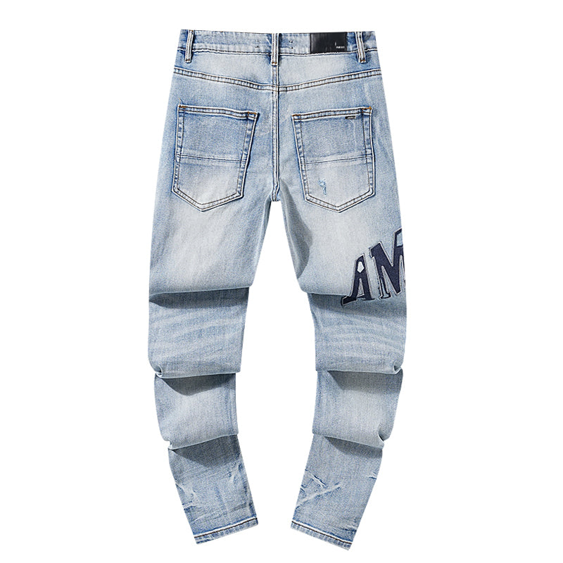 AMIRI Thrasher Distressed Jeans With Logo